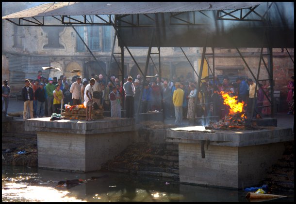Cremation ceremony being carried out by the Bagmati River